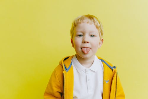 Free Boy in Yellow Jacket and White Shirt Zip Up Jacket Stock Photo