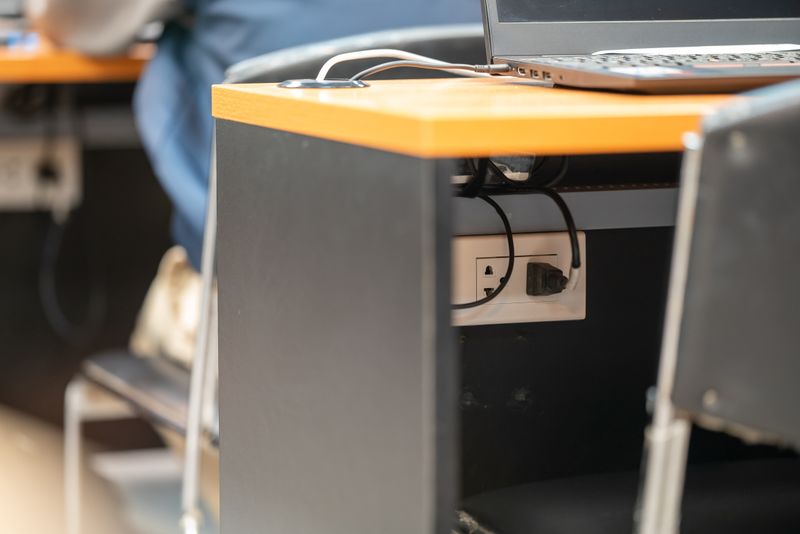 fabric cable box hiding a power strip and adapters