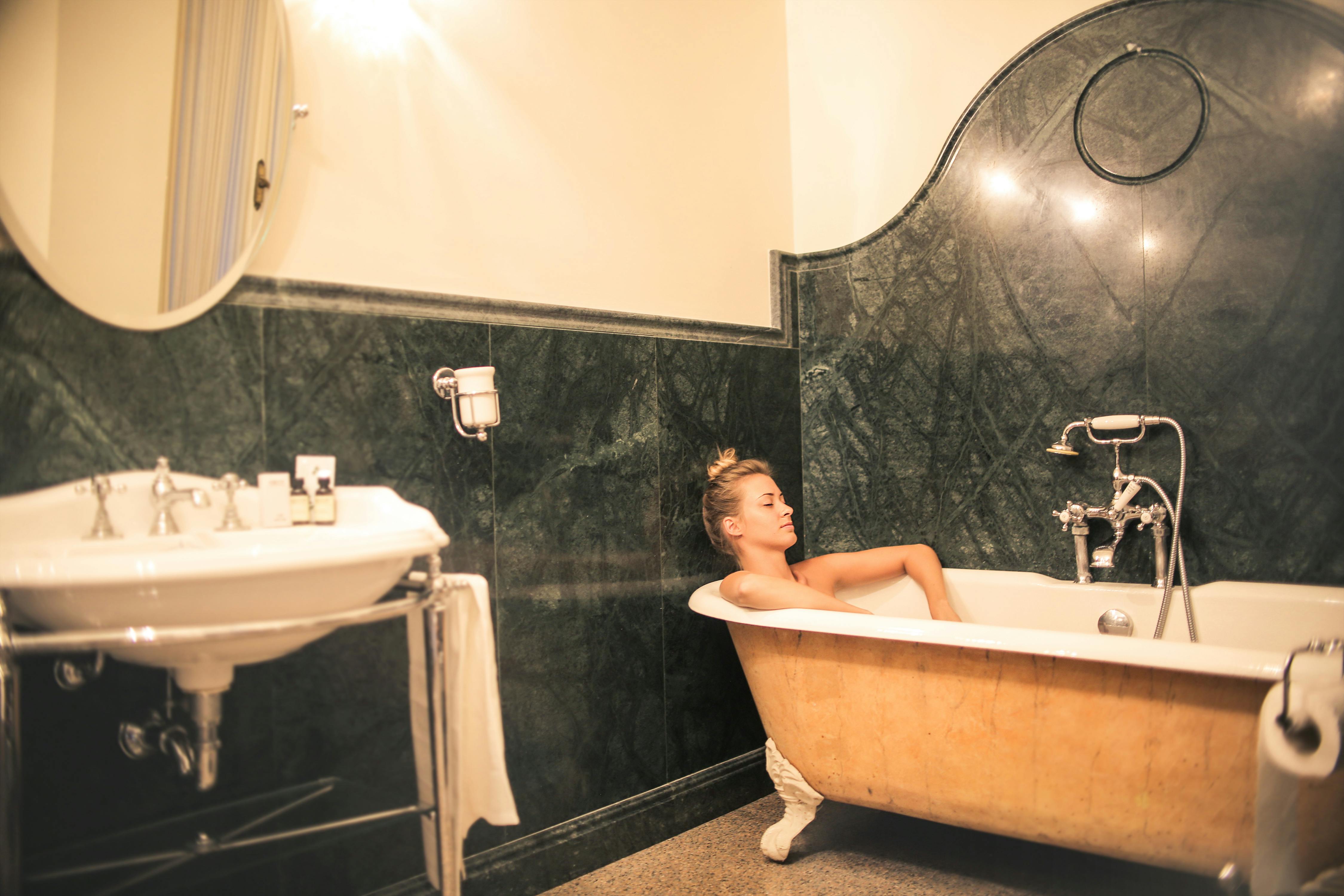 topless relaxing on bathtub