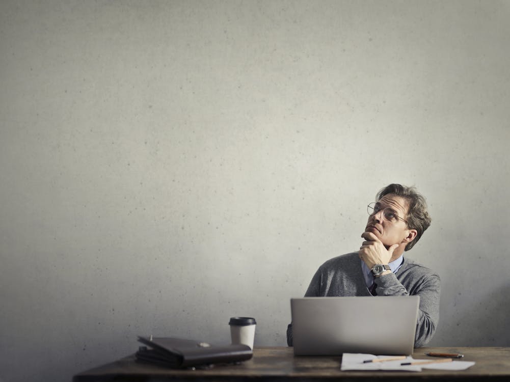 Free Photo of a Man Using Laptop Stock Photo