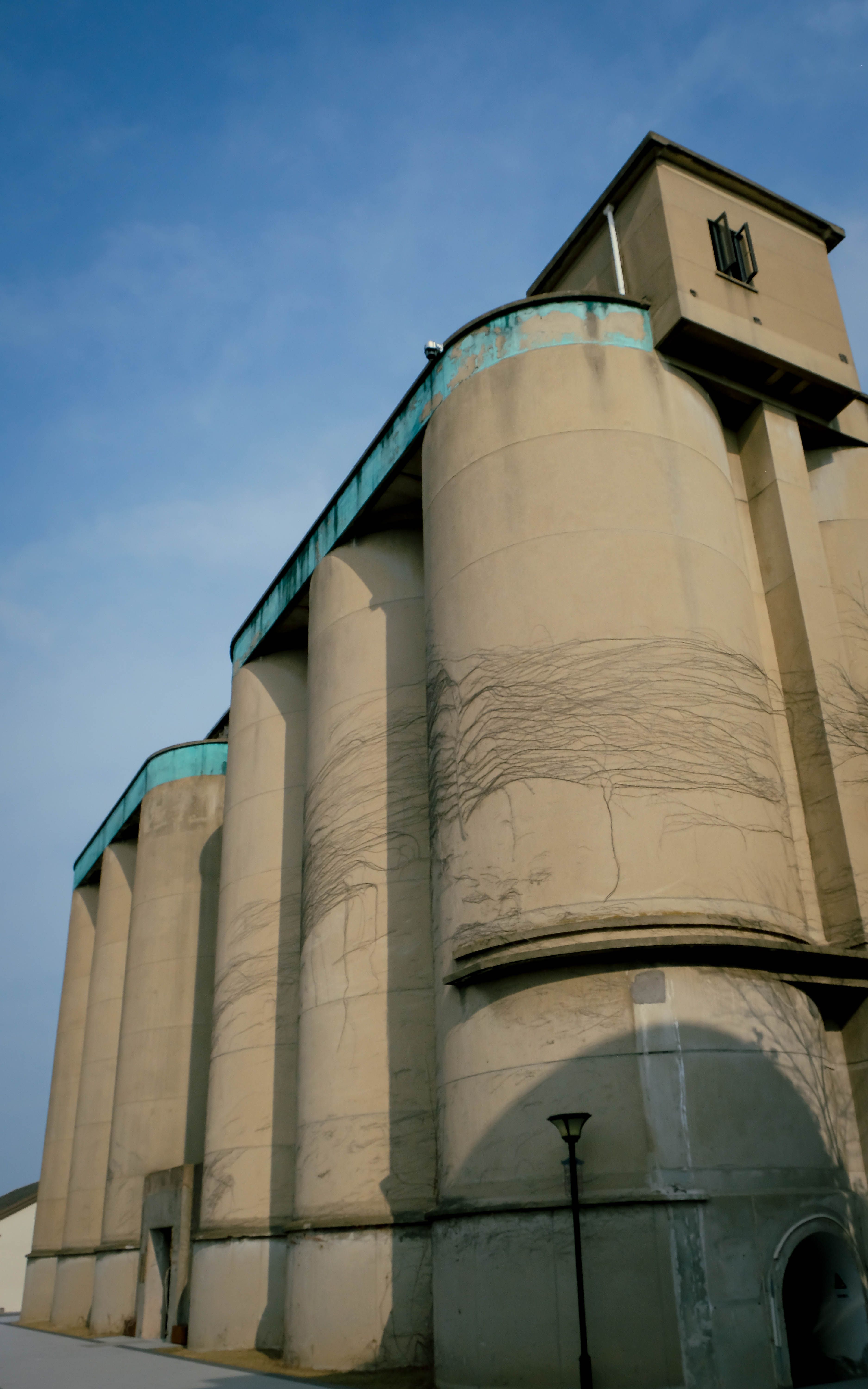 Industrial Silos Against Blue Sky · Free Stock Photo