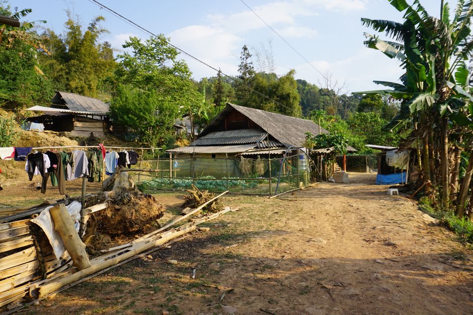 A glimpse of everyday rural life in Bac Ha, Vietnam with traditional houses.