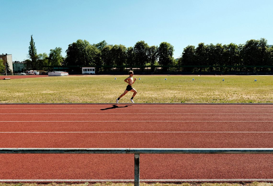Female athlete running on an outdoor track