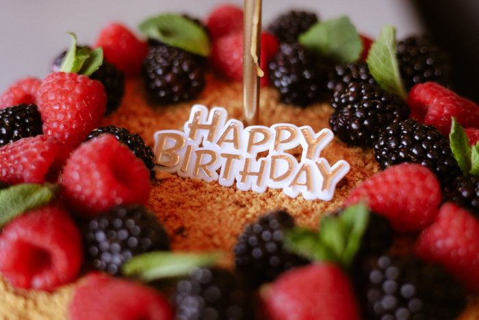 Customised birthday cake with fresh berries