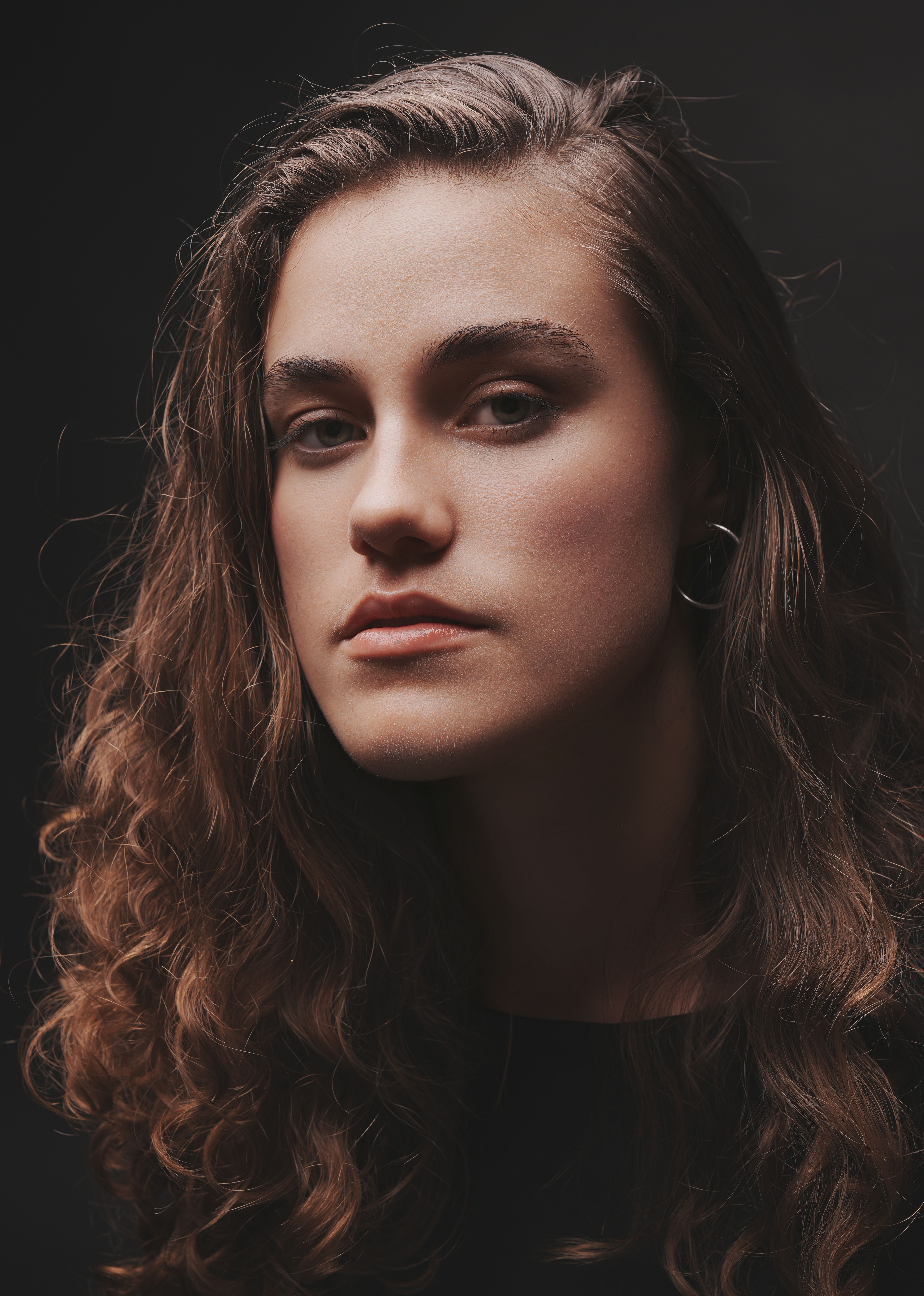 Artistic Portrait of Woman with Curly Hair · Free Stock Photo