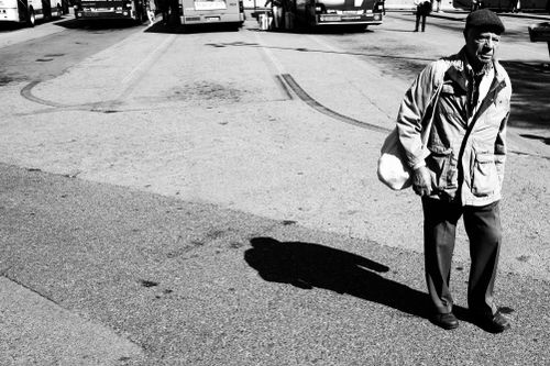 Free Monochrome image of an elderly man walking in a bus station in Venice, Italy. Stock Photo