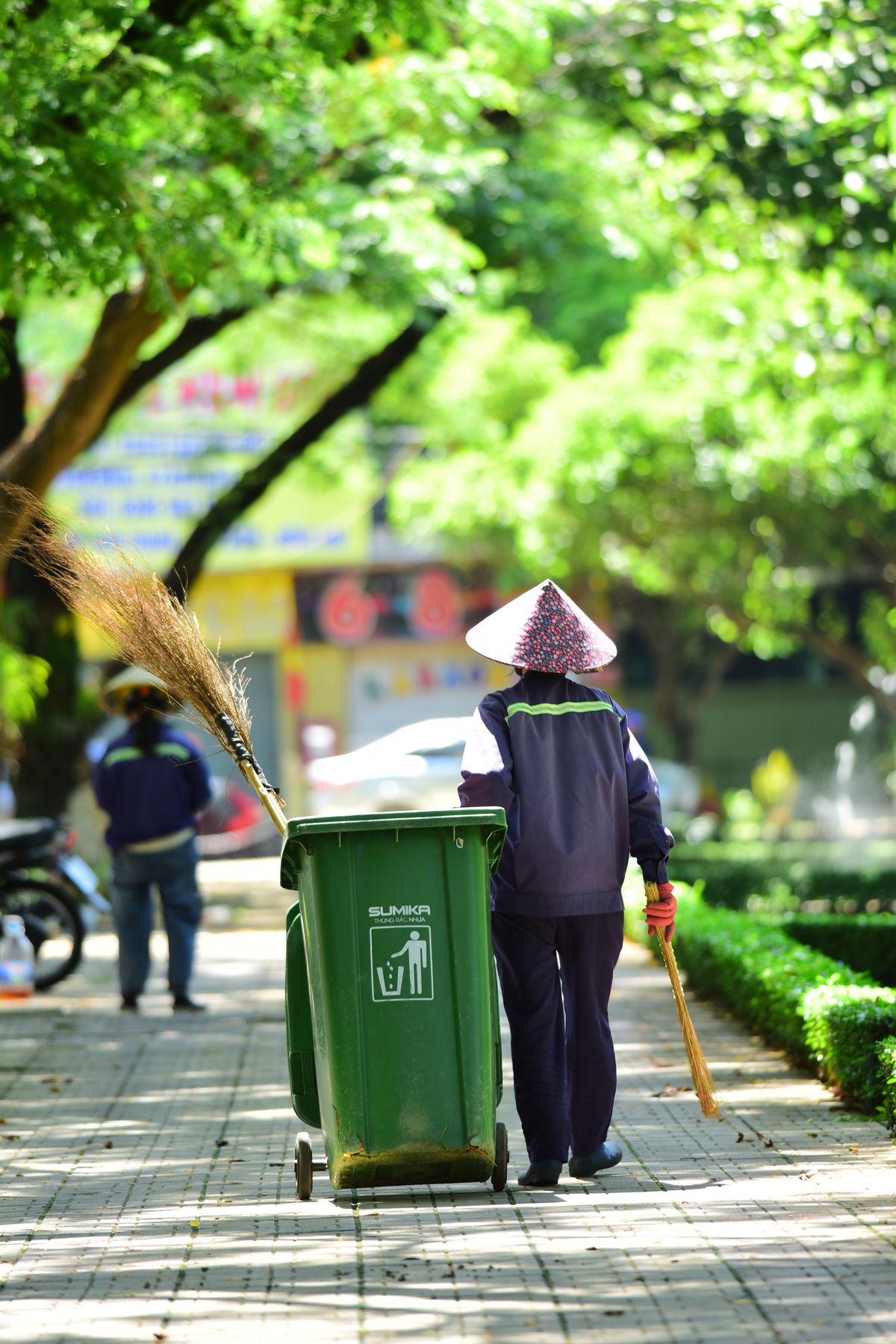 Man Cleaning the Walkway in a Park · Free Stock Photo