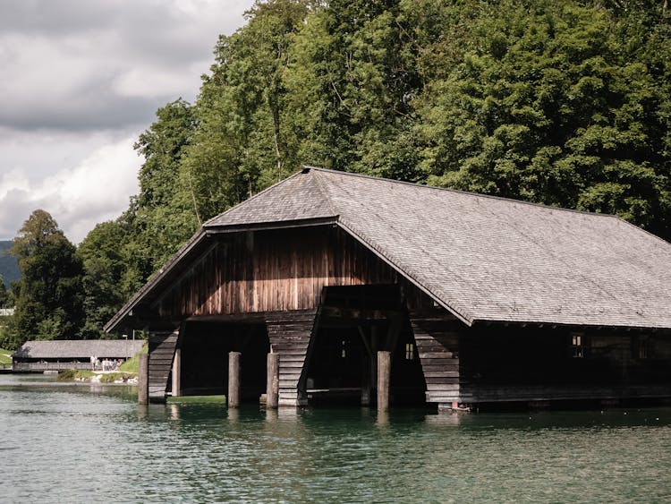 Wooden Boathouse In A Body Of Water