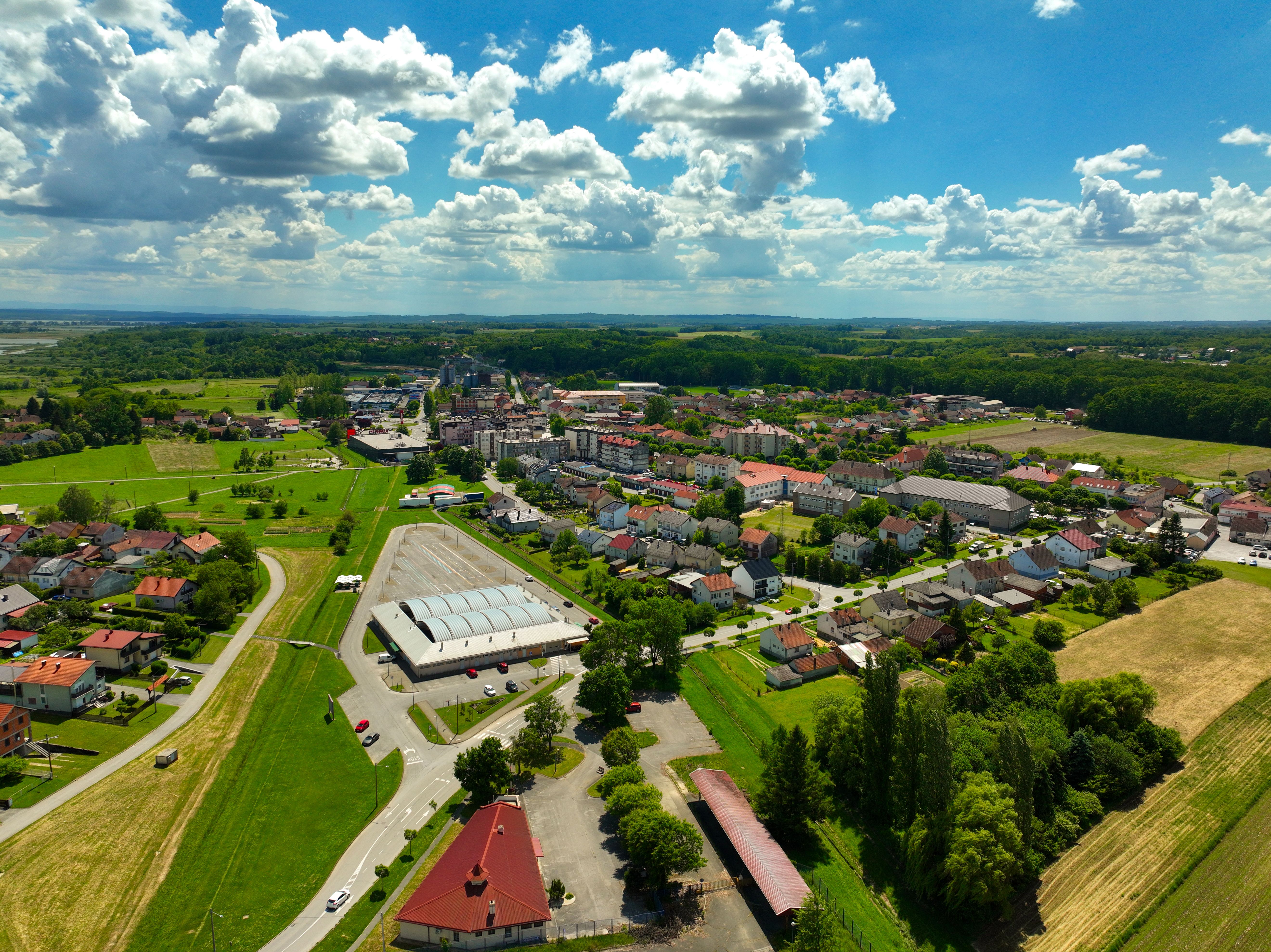 Vibrant aerial shot of Garešnica, Croatia showcasing the town's landscape under a bright blue sky.