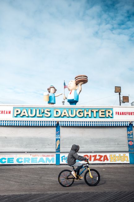 A person cycles by the famous Paul's Daughter restaurant at Coney Island, New York.