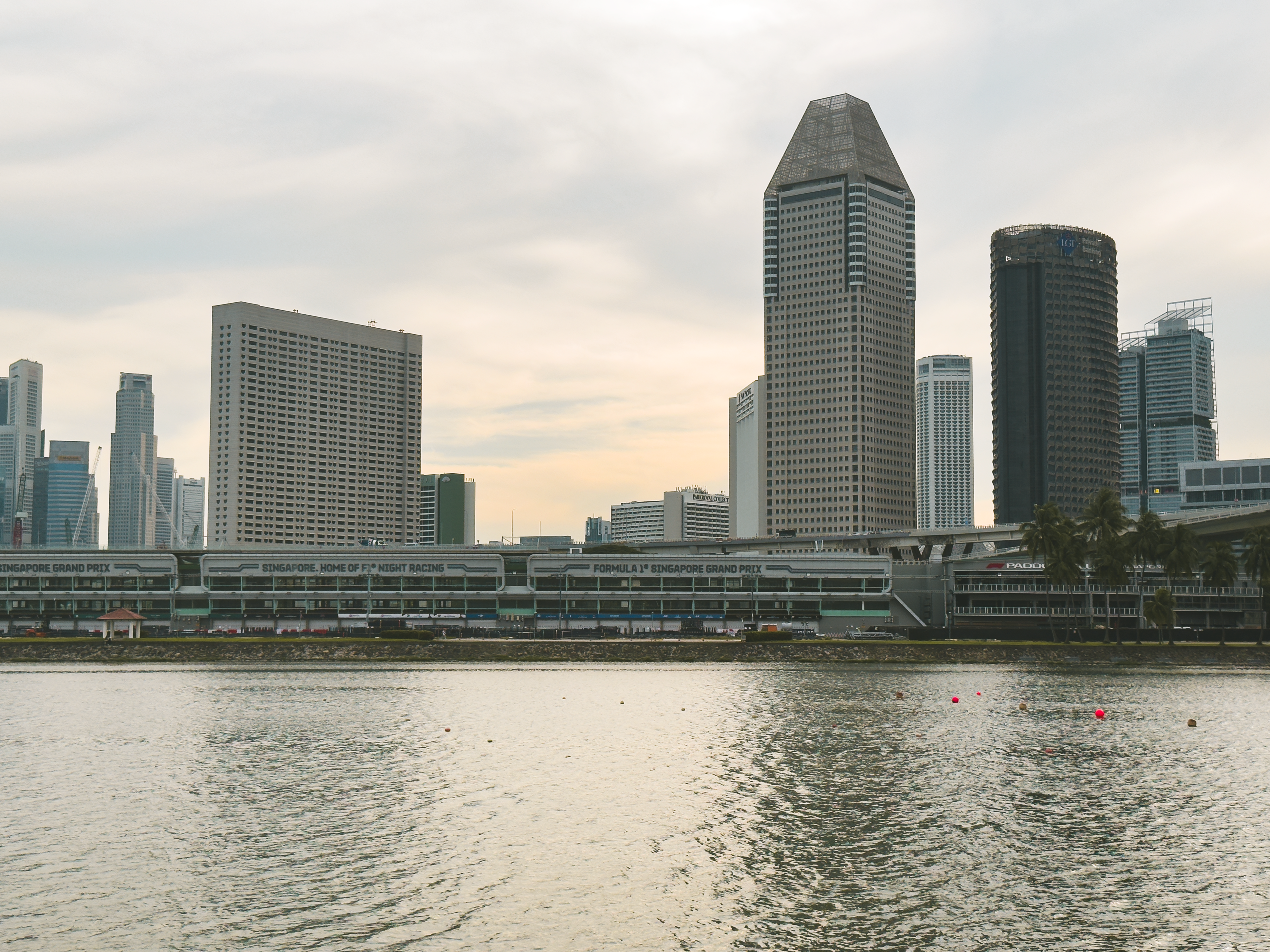 Panoramic view of Singapore skyline, showcasing Marina Bay skyscrapers and waterfront.