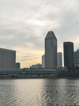 Dramatic view of Singapore's skyline featuring iconic skyscrapers and waterfront.