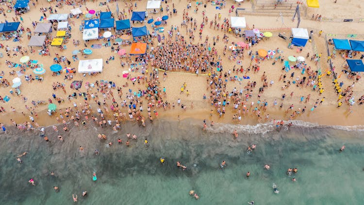 Crowd Of People On Tropical Beach