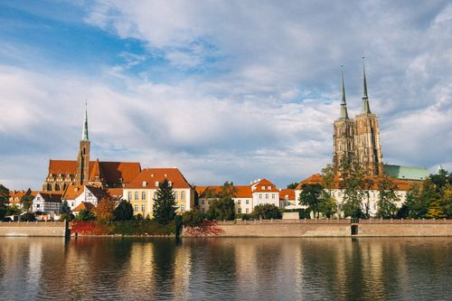 Free Beautiful view of Wroclaw Cathedral along the Odra River in Poland, showcasing historic architecture and autumn scenery. Stock Photo