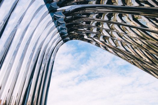 Stunning abstract view of reflective architecture against a clear blue sky in Wrocław, Poland.