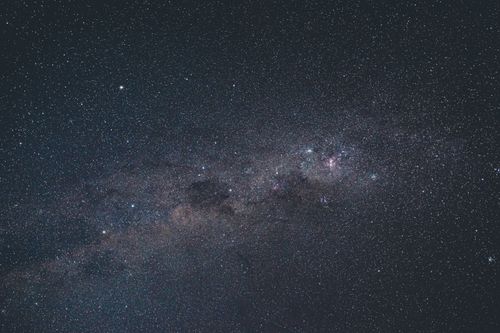 Free Background of glowing constellation of bright stars high in dark sky at night Stock Photo
