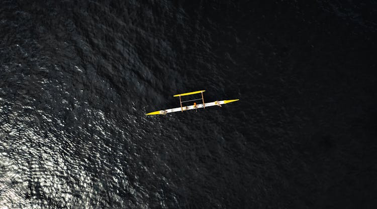Aerial Photography Of Small Vessel On Sea
