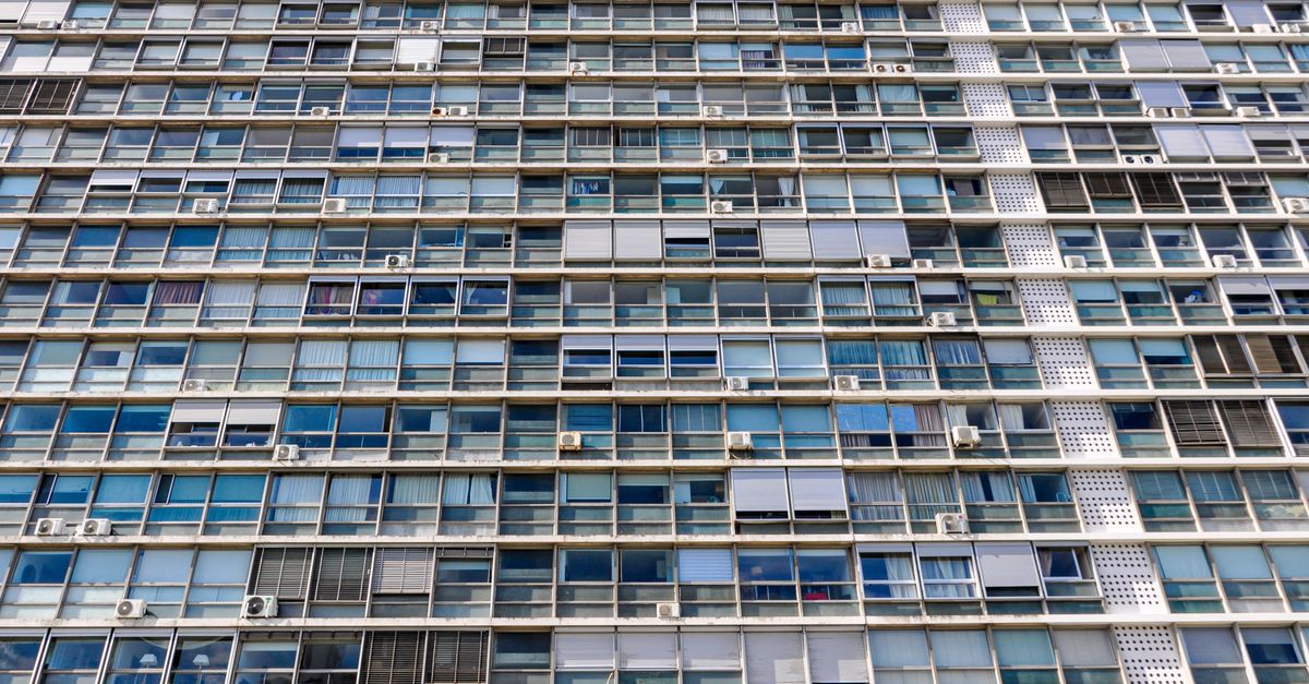 High-rise apartment building with glass windows in Montevideo, Uruguay highlighting urban architecture.