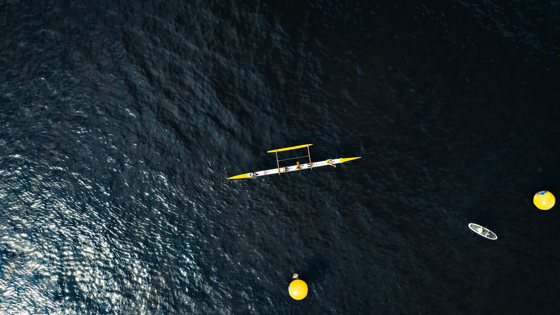 White and Yellow Motor Boat on Body of Water