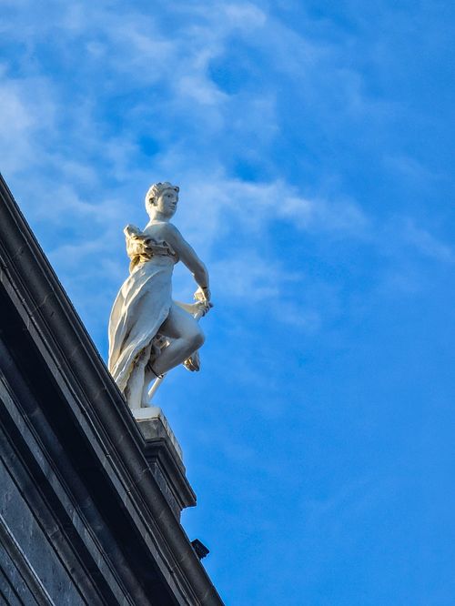Free A graceful statue on a rooftop in Las Palmas de Gran Canaria, set against a bright blue sky. Stock Photo