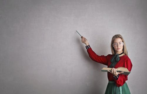 Free Woman in Discussing A Lesson Plan Stock Photo