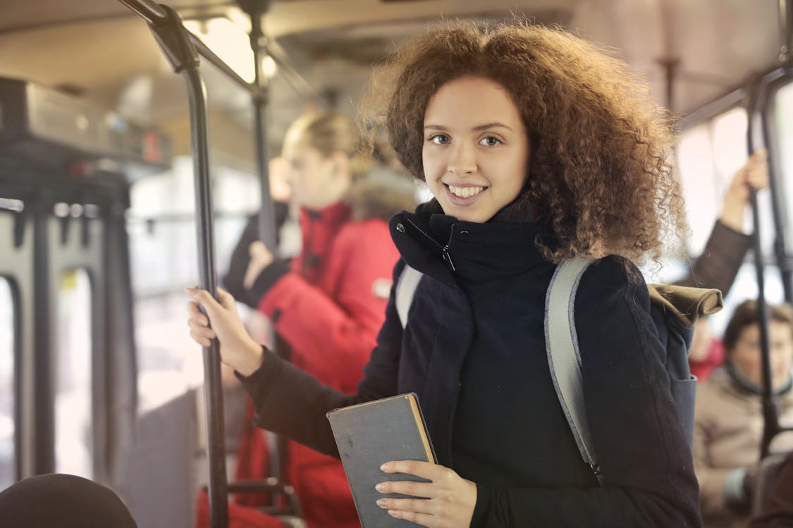 Free Woman in Black Coat Riding Subway Stock Photo