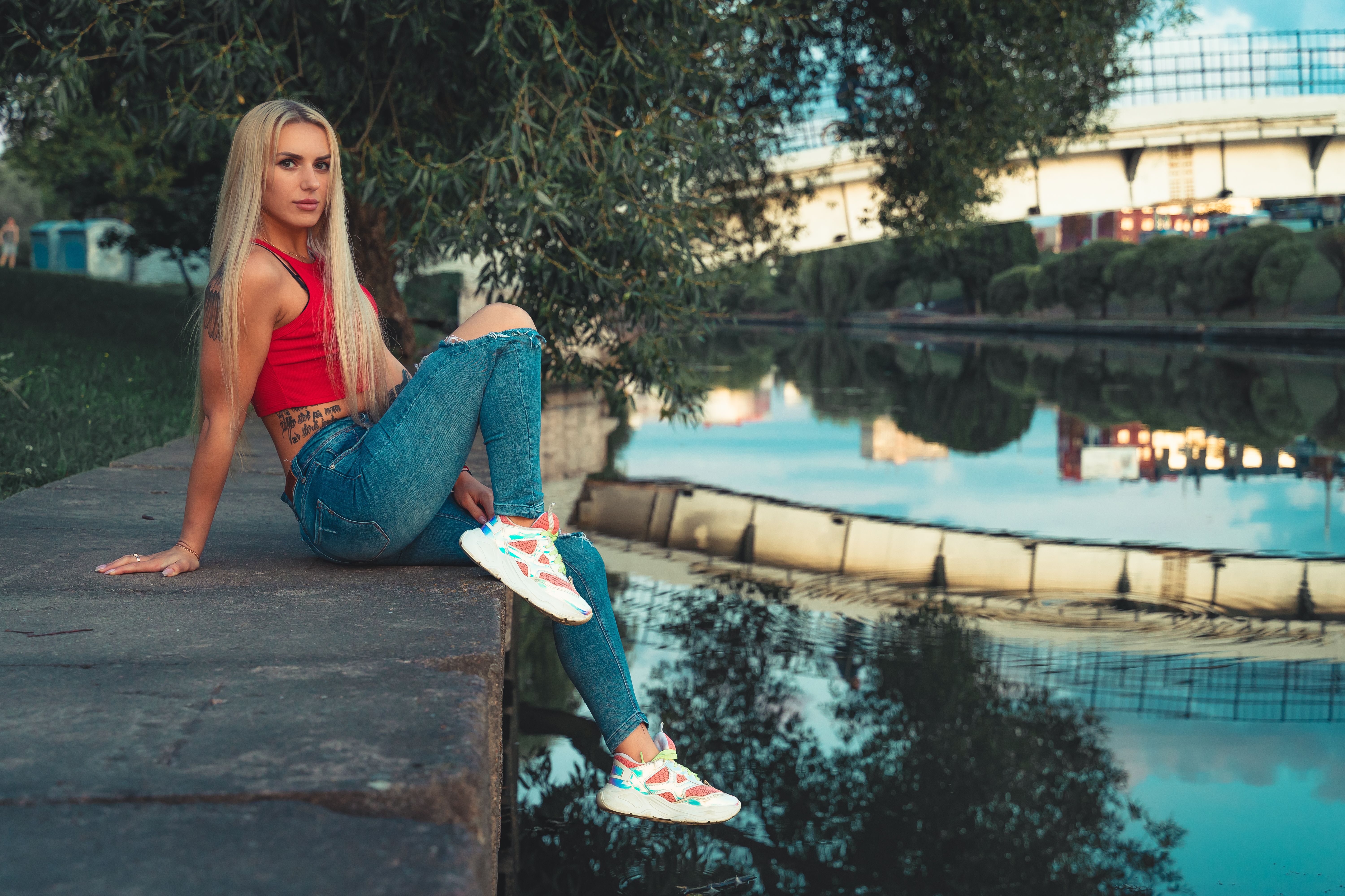 Stylish Woman Relaxing by Minsk Riverside · Free Stock Photo