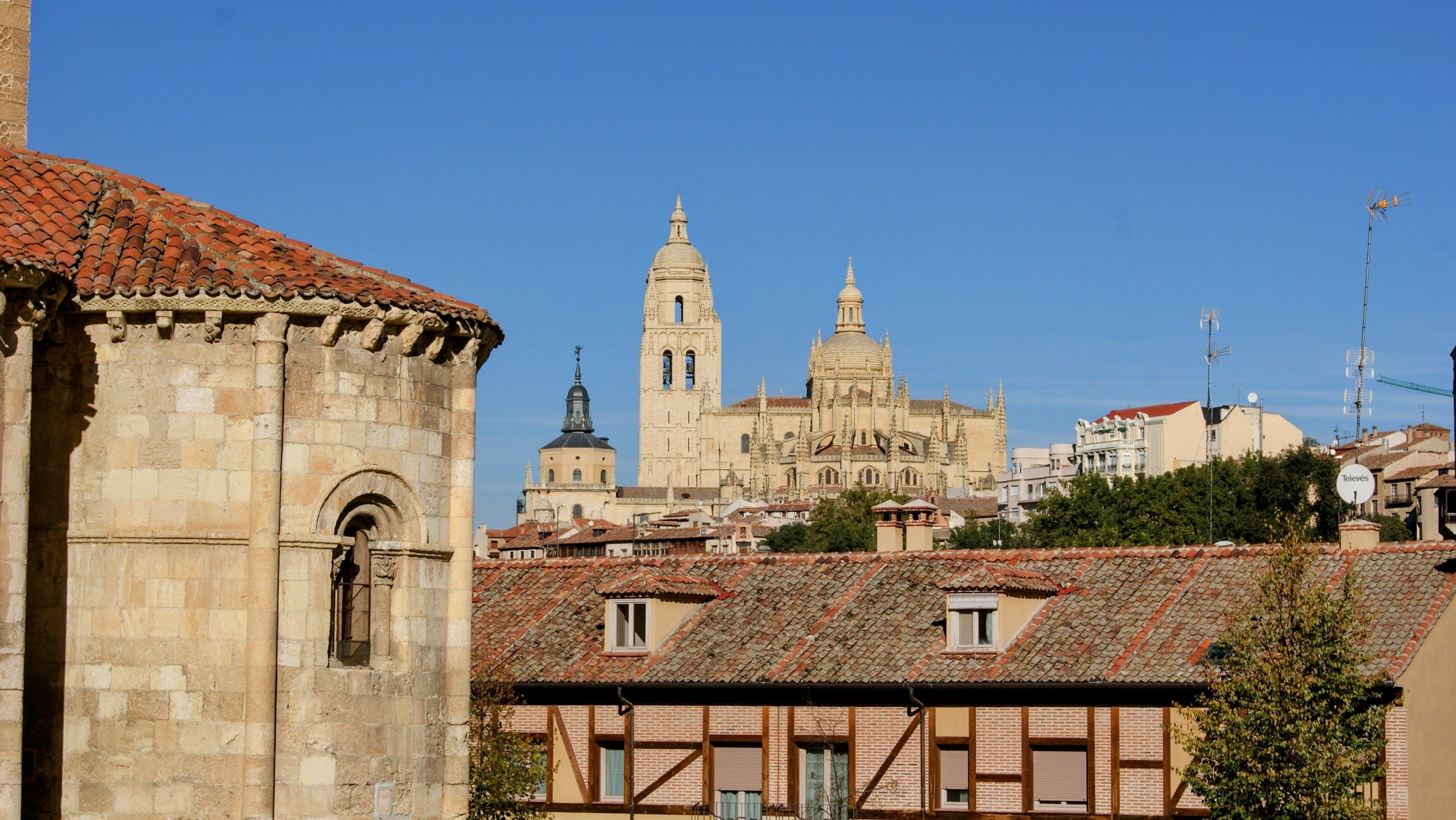 Segovia's ancient aqueduct and medieval streets at sunset