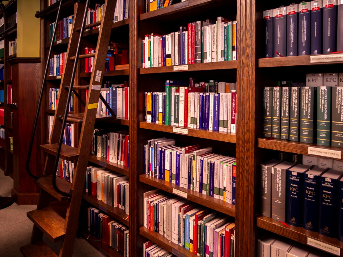 DIFC, ADGM and sector laws beyond the PDPL Library shelves with a ladder