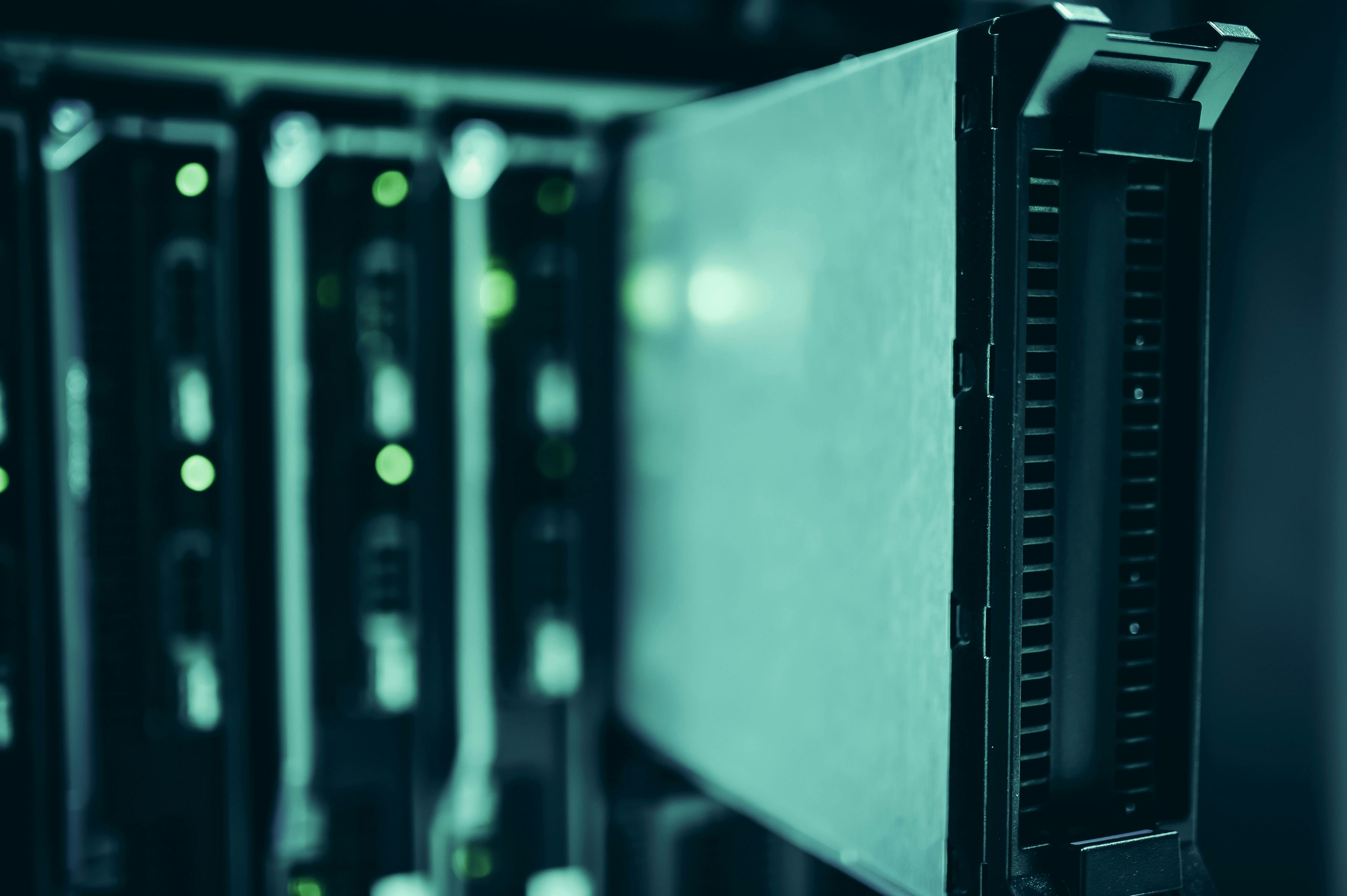 Server racks in a data center, reflecting the infrastructure build-out underpinning the latest AI trade.
