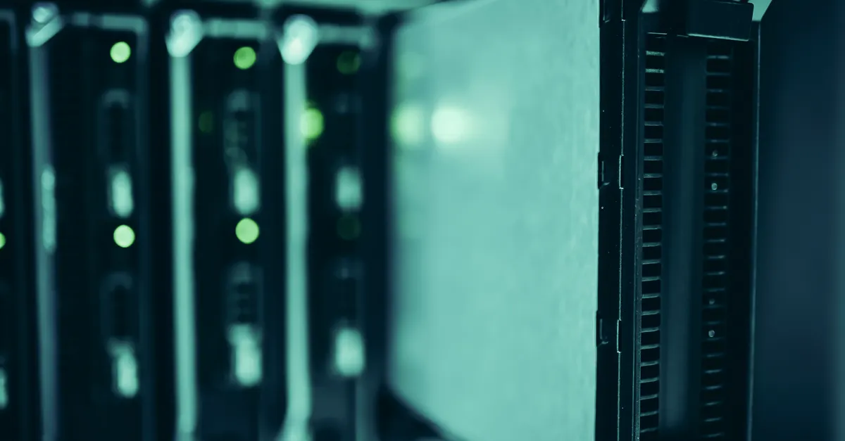 Server racks in a data centre with rows of blue indicator lights, representing in-country data hosting