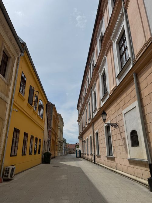 Free Quiet street in Osijek's historic center with colorful architecture under a bright sky. Stock Photo