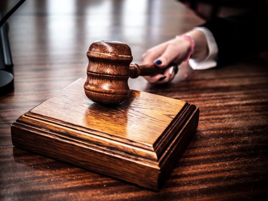 courtroom gavel sitting on a wooden desk courtroom gavel sitting on a wooden desk