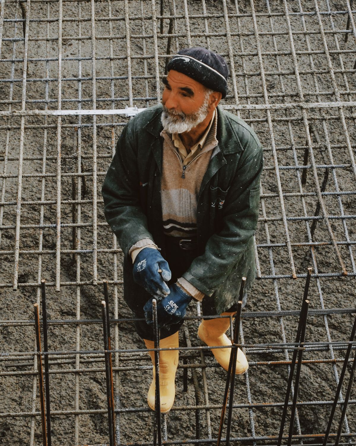 Crew fixing reinforcement steel on a foundation mat
