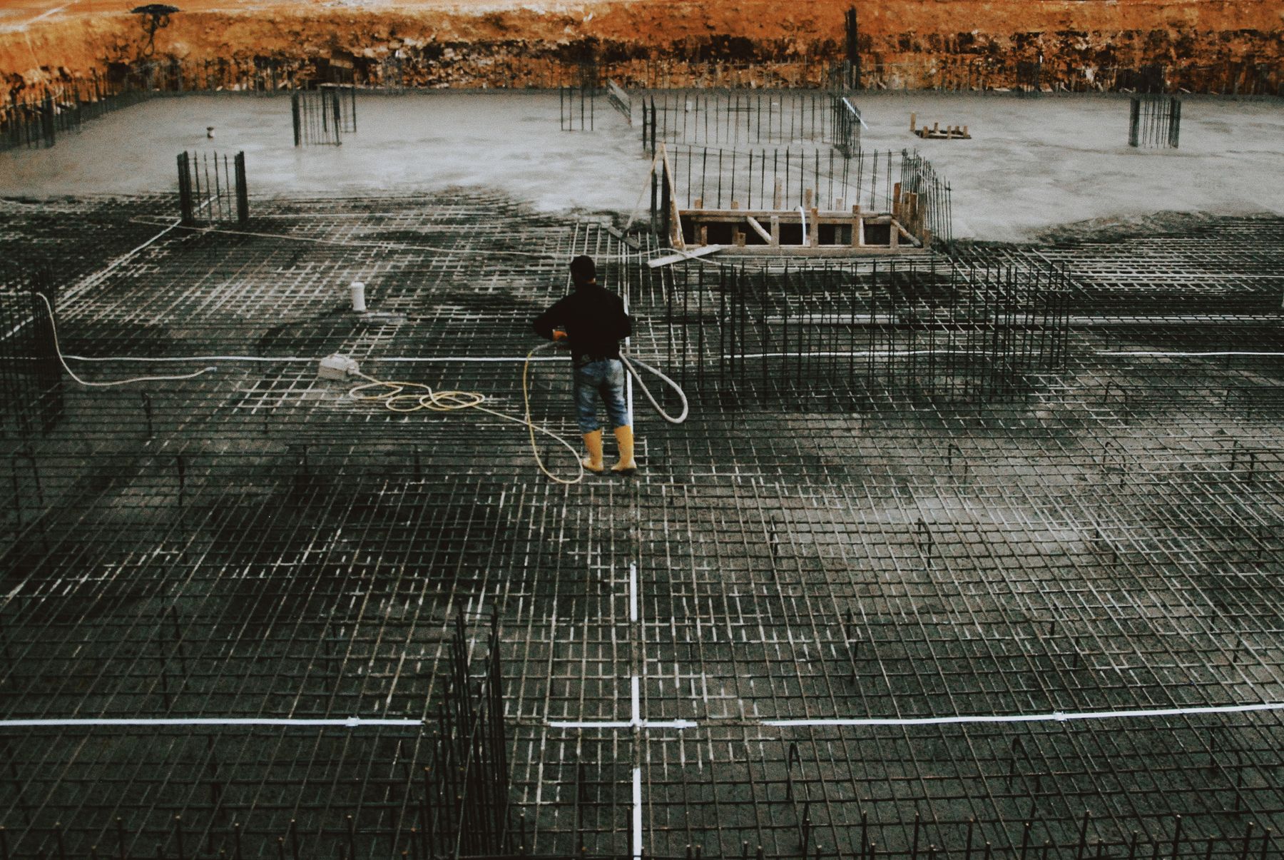 Worker on a reinforced concrete foundation