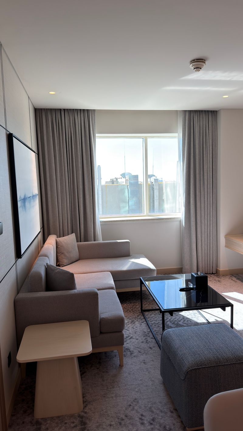 Modern minimalist living room with light floor