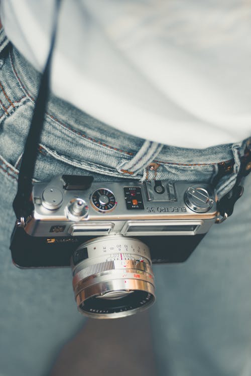 Free  Person With Silver and Black Camera  Stock Photo