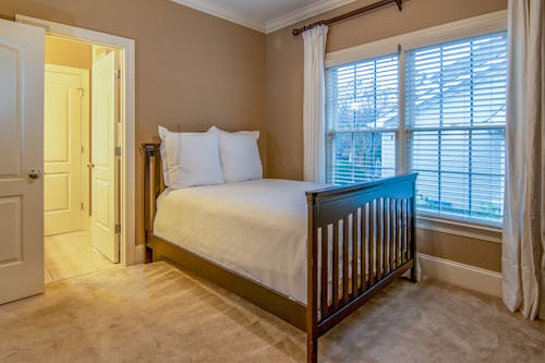 Free Brown Wooden Bed Inside Bedroom Stock Photo