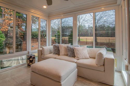 Free White Couch Near Glass Windows Stock Photo