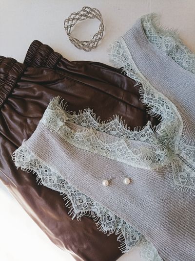 Black lace-trimmed camisole laid flat — photo by elena_ sher on Pexels