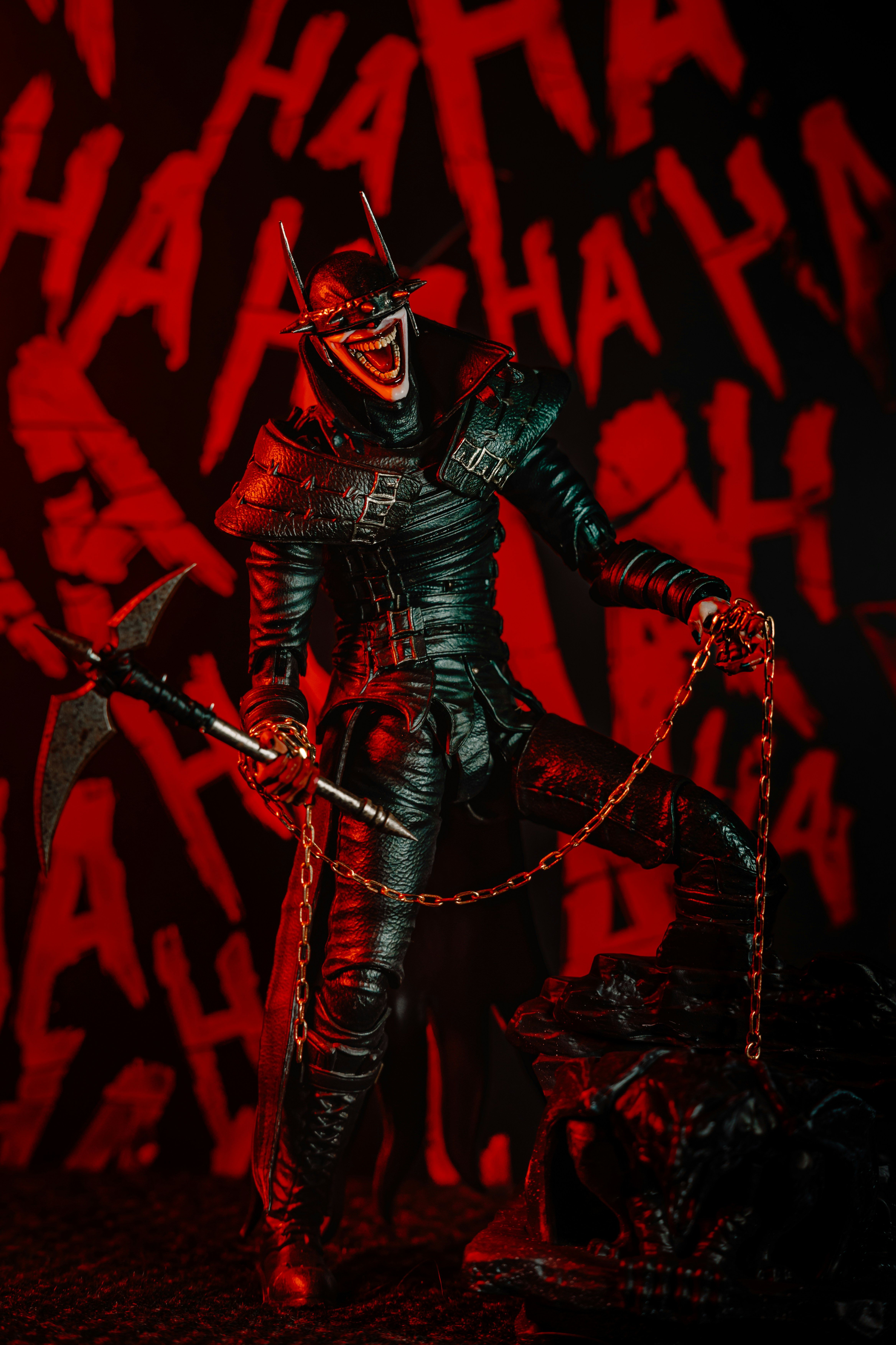 A sinister black figure with red lighting and ha ha text on a background.