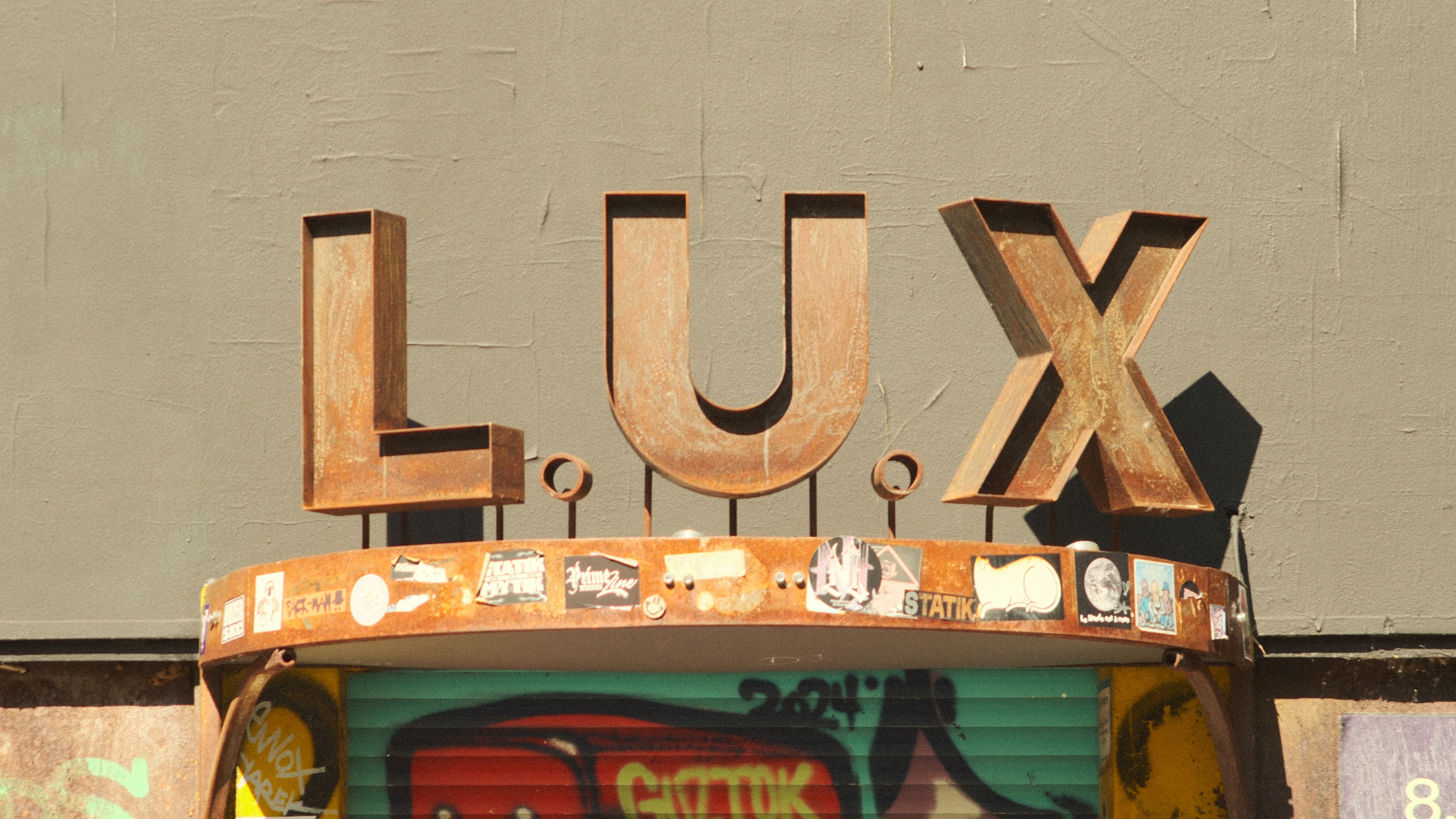 Rustic Lux Sign in Berlin Urban Setting · Free Stock Photo