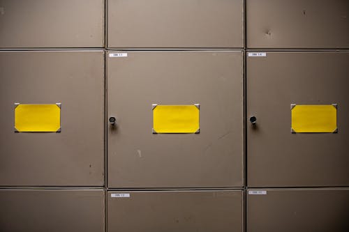 Yellow Paper on Gray Metal Cabinet