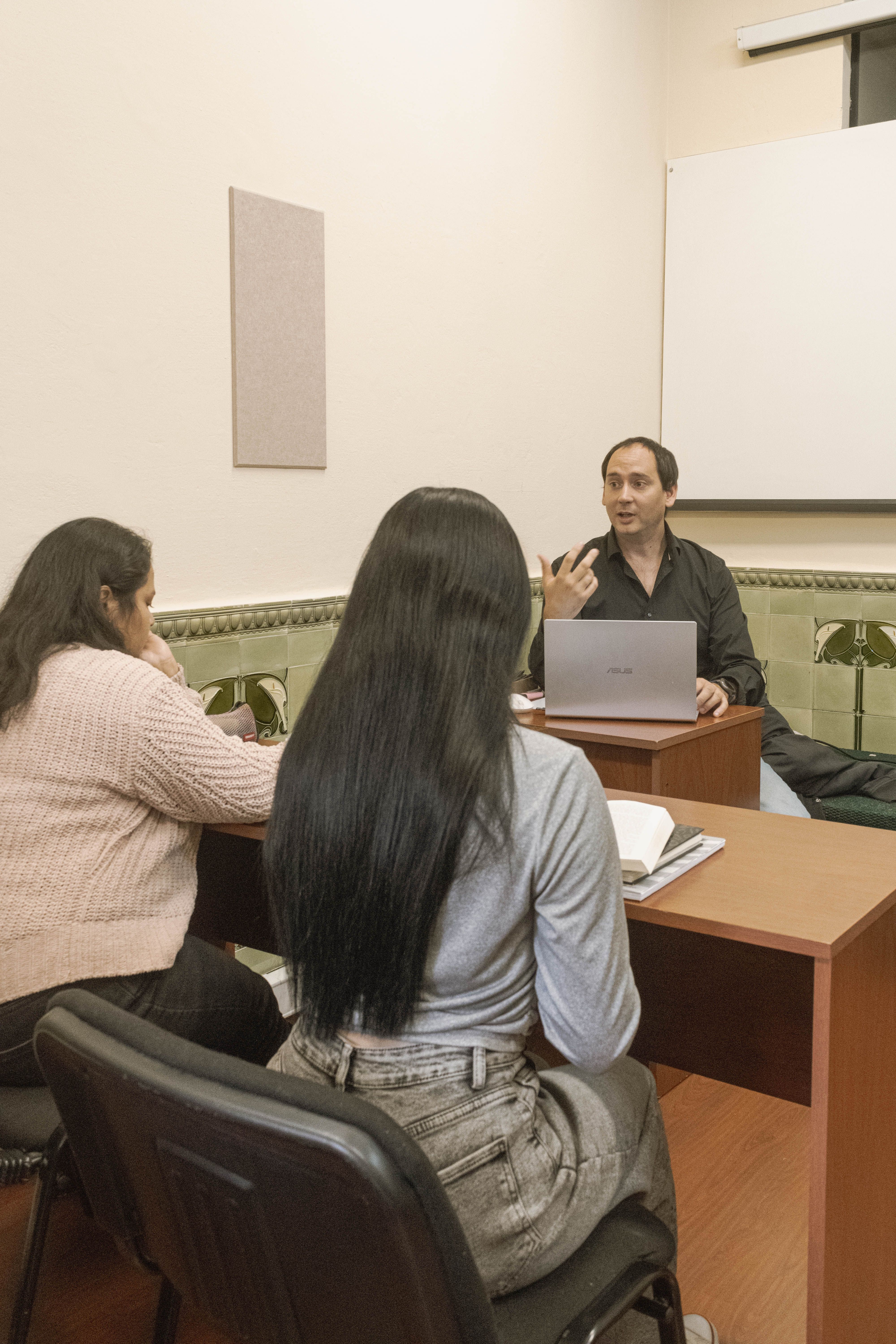 Teacher and students engaged in a classroom discussion in Montevideo, Uruguay.