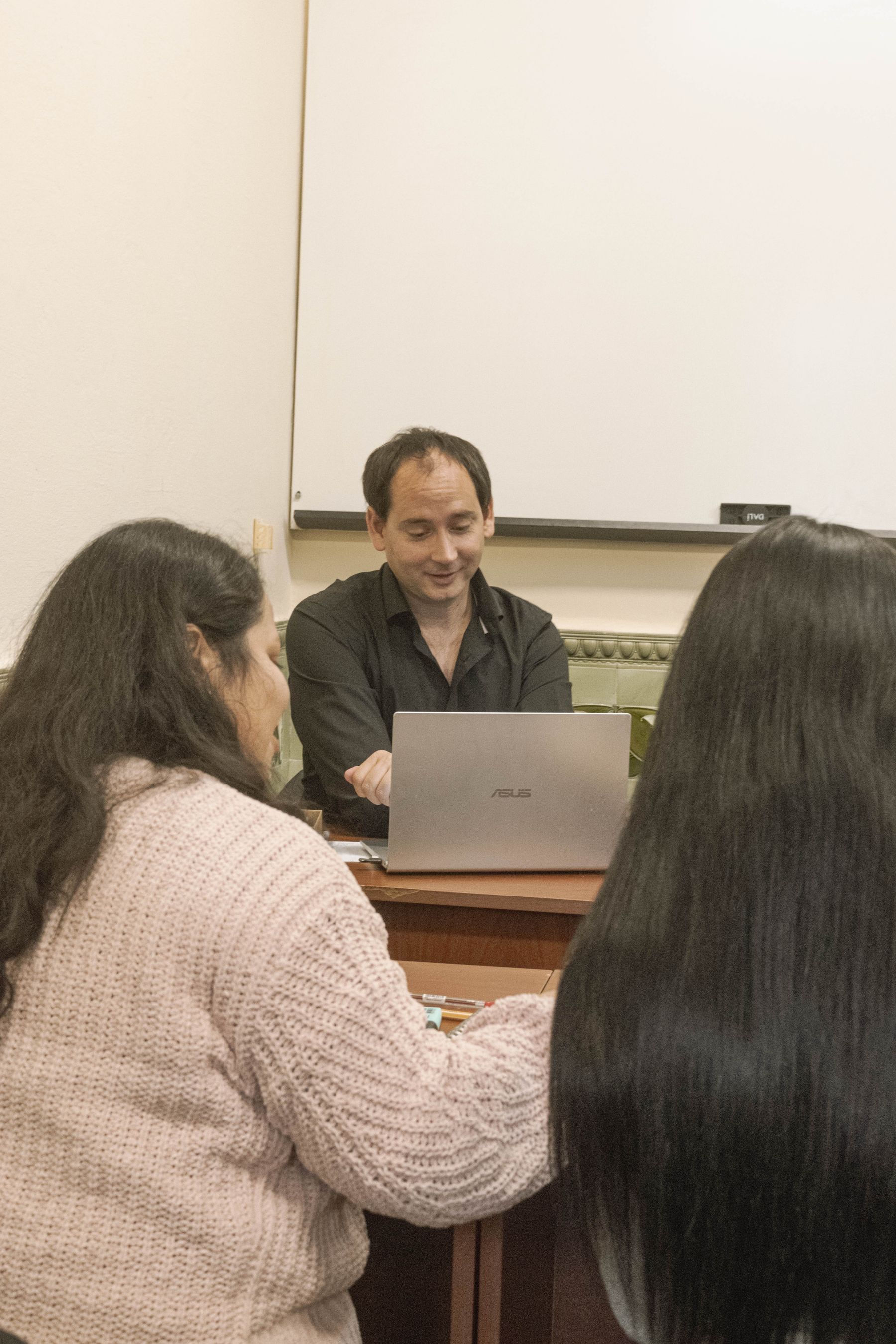 Business team reviewing a proposal on laptops