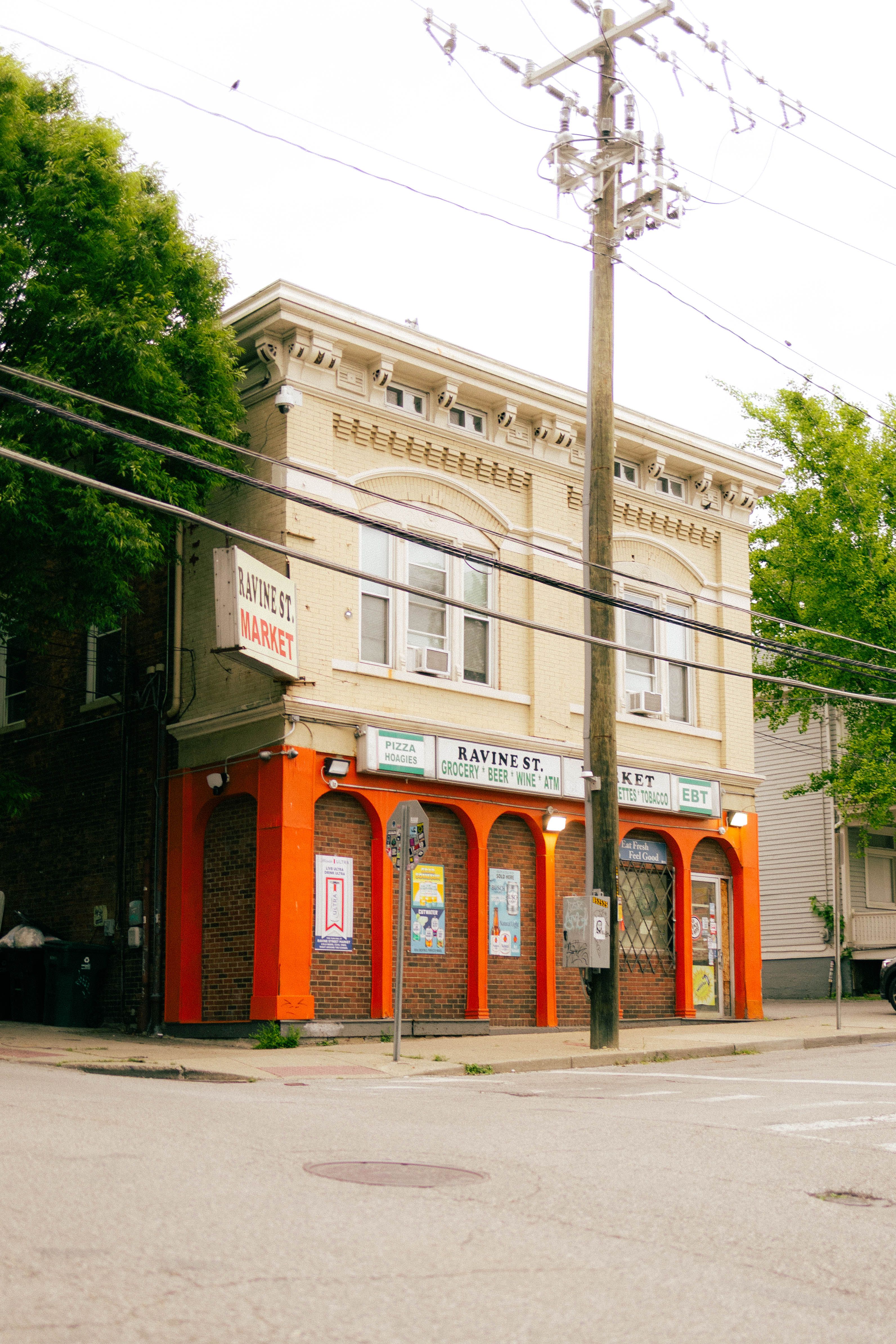 Quaint Urban Corner Storefront on Ravine Street · Free Stock Photo