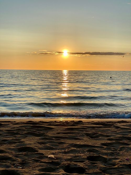 Free Breathtaking sunset view over the Mediterranean Sea from an Algerian sandy beach. Stock Photo
