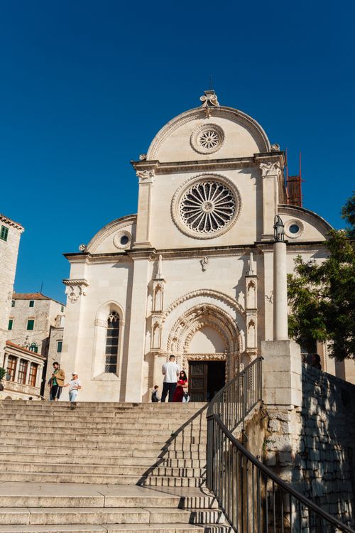 Free St. James Cathedral in Šibenik, Croatia, under a bright blue sky, showcasing its intricate architecture. Stock Photo