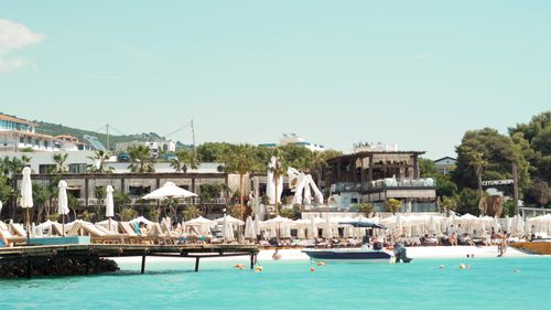 Free Explore the bustling beachside scene at a sunny resort in Ksamil, Albania. Stock Photo