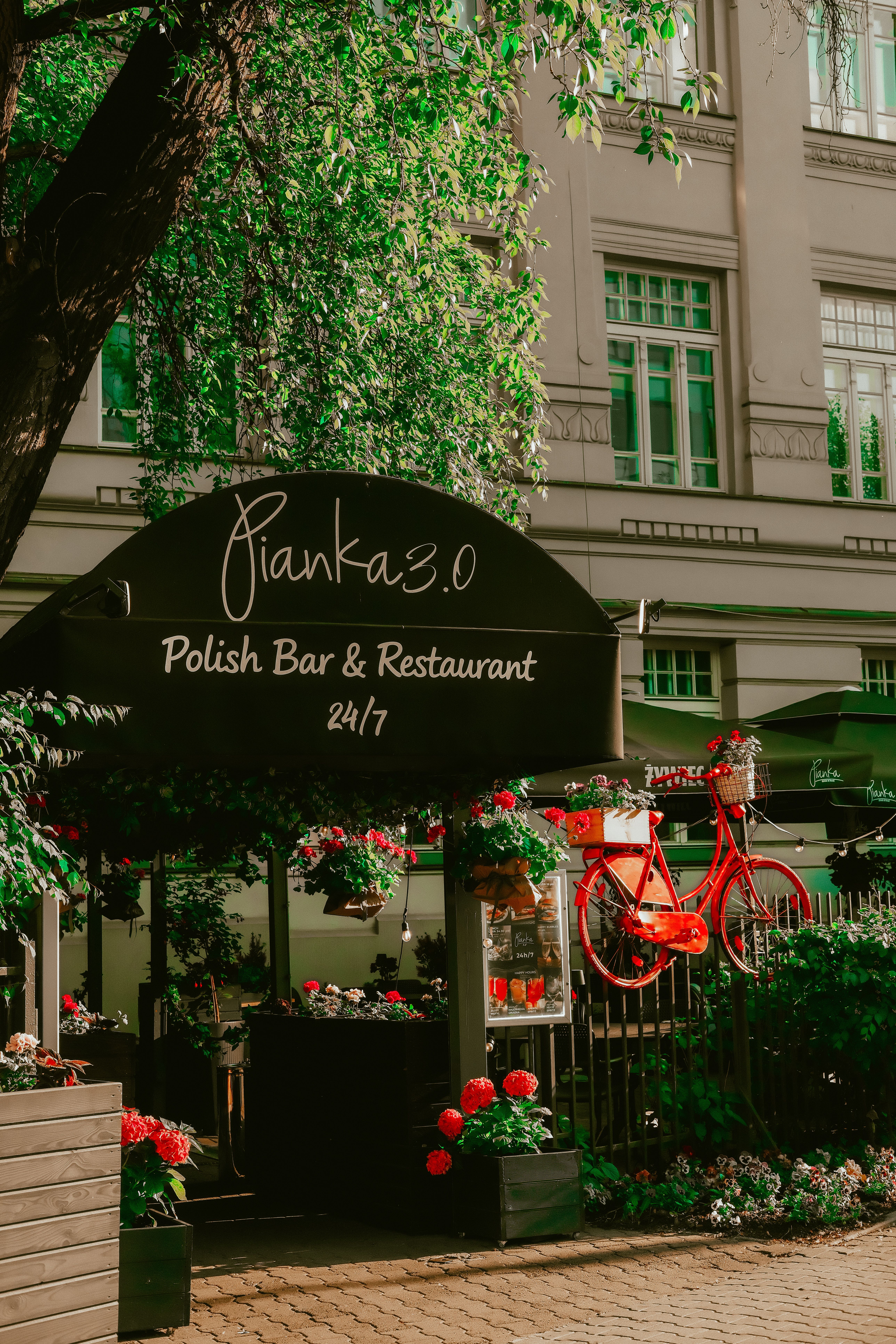 Cozy outdoor view of Pianka 3.0, a Polish bar and restaurant in Warsaw.